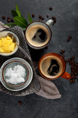 Bulletproof keto coffee. Ketogenic diet. Hot dring with coconut oil and ghee butter on dark background