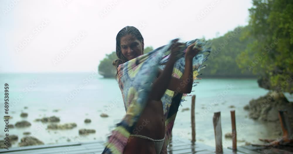 Poster Summer, relax and a woman in a bikini at the beach for travel, vacation or adventure on the coast. Ocean, wellness and holiday with a young person in a swimsuit for freedom on an island by the sea