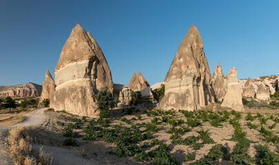 farming land in Rose Valley with the spectacular rock formation in the background, Cappadocia,...