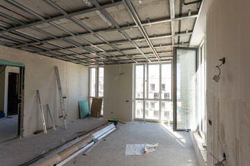 Drywall installation work in progress by construction workers at construction room. easiest and...