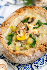 Potato soup with mushrooms in a loaf of bread.