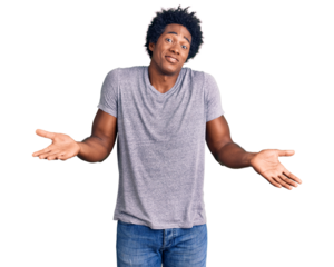 Handsome african american man with afro hair wearing casual clothes clueless and confused expression with arms and hands raised. doubt concept.