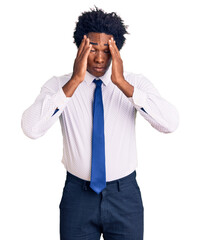 Handsome african american man with afro hair wearing business clothes suffering from headache...