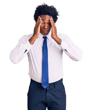 Handsome african american man with afro hair wearing business clothes suffering from headache desperate and stressed because pain and migraine. hands on head.