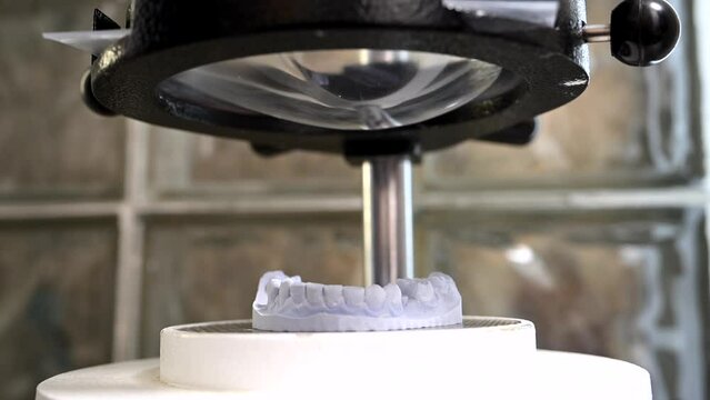 Mouth guard for teeth, printed on a 3D printer in dental clinic laboratory. 4k cinematic slow motion video