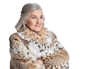 portrait of happy beautiful senior woman in fur coat