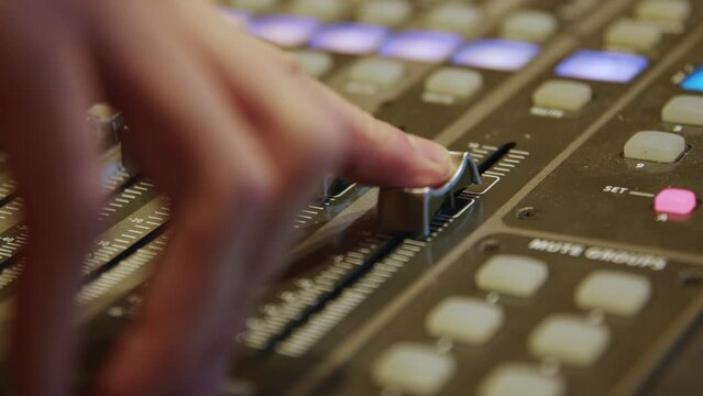 Audio mixer turning up the volume