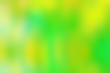 Abstract blurred background image of green, yellow colors gradient used as an illustration. Designing posters or advertisements.