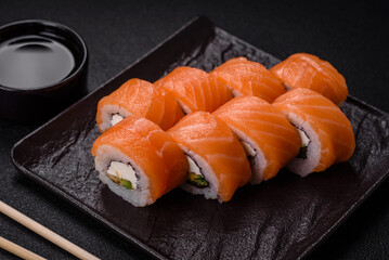 Delicious Philadelphia sushi roll with salmon, shrimp, cucumber and cream cheese