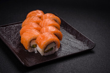 Delicious Philadelphia sushi roll with salmon, shrimp, cucumber and cream cheese