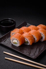 Delicious Philadelphia sushi roll with salmon, shrimp, cucumber and cream cheese
