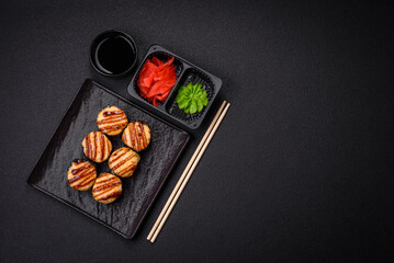 Delicious warm sushi roll with tuna, salmon, shrimp, cucumber and cream cheese