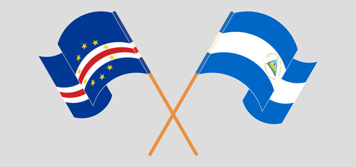 Crossed and waving flags of Cape Verde and Nicaragua