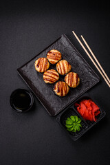 Delicious warm sushi roll with tuna, salmon, shrimp, cucumber and cream cheese