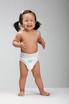Studio shot of a happy Chinese baby girl