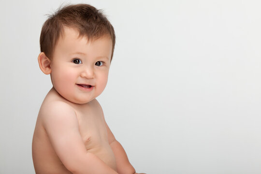 Studio shot of a cute Chinese baby boy looking at the camera