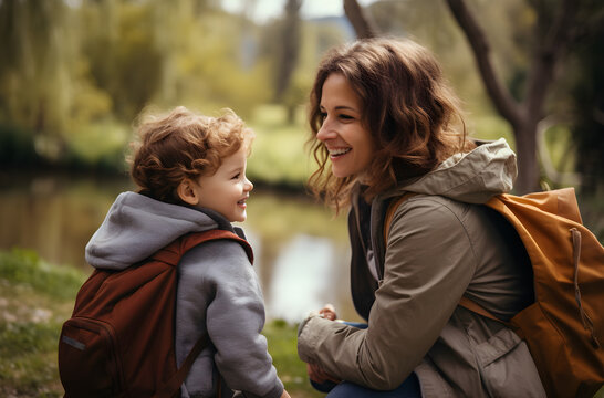 Outdoor Adventures - Mom and child enjoying an outdoor activity together in a park, sharing a joyful moment, happiness scene
