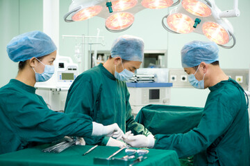 Three surgeons in an operating room