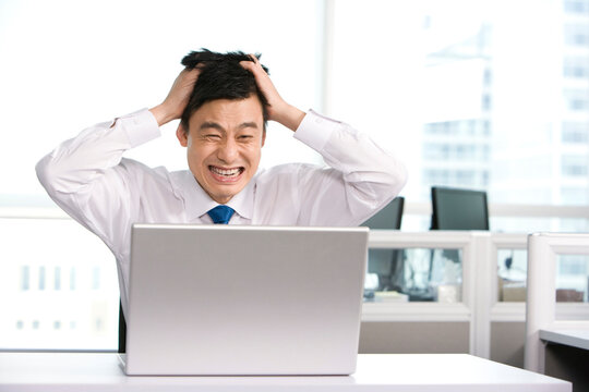 Frustrated office work at his desk