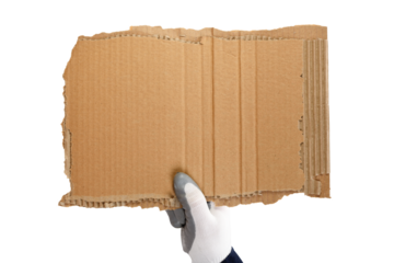 A worker's hand in a glove and a blue jacket is holding a piece of cardboard. Isolated on a white background.Strike.