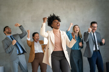 Excited overjoyed diverse business people, team celebrate corporate victory together in office