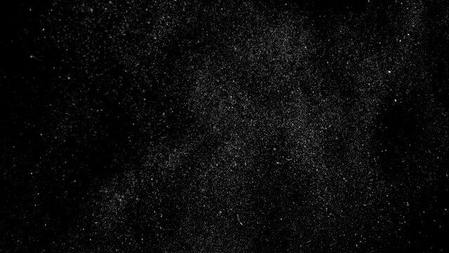 Dust particles on black background, seamless 3D effect. Abstract dust particles with white light bokeh, snow glare and flare sparkles