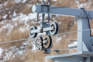 Metal parts of a ski lift in the mountains
