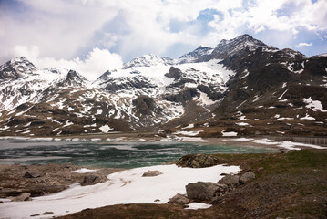 Fototapeta na wymiar Mountain lake with ice in Switzerland in spring