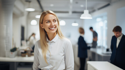 A friendly Head of Revenue Operations interacting with staff in the office kitchen, Head of Revenue Operations, blurred background, with copy space