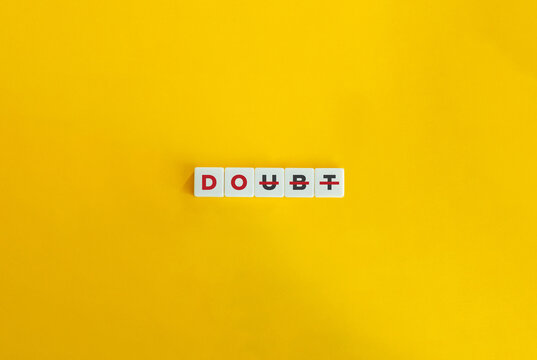 Do and Doubt Word. Overcome Self-doubt Concept. Self-Confidence, I Can, I am Good Enough. Block Letter Tiles on Yellow Background. Minimalist Aesthetics.