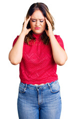 Young beautiful caucasian woman wearing casual clothes suffering from headache desperate and stressed because pain and migraine. hands on head.