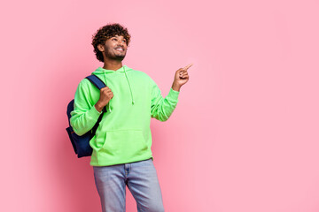 Photo of cheerful young man in trendy green sweatshirt point finger novelty buy materials for...