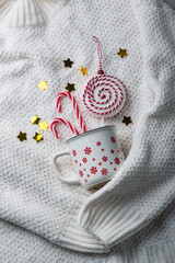 Christmas composition in white knitted background