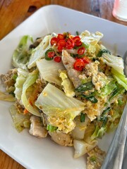 Dry sukiyaki fried vermicelli with vegetables and pork. Stir fried sukiyaki with vegetables and meats without broths. Stir fried mixed vegetable in sukiyaki sauce on plate. Healthy Food.