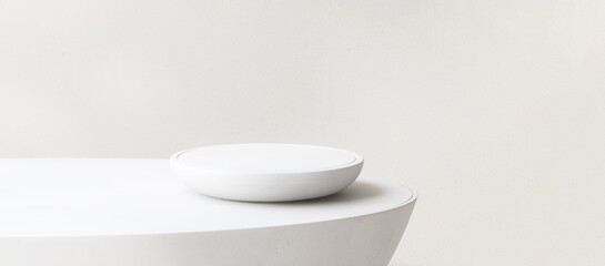 Modern round white plate shape podium on table counter in sunlight for luxury organic cosmetic,...