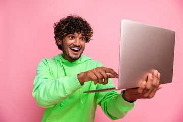 Photo of guy wearing green hoodie click keyboard looking at netbook display amazed bull bitcoin...