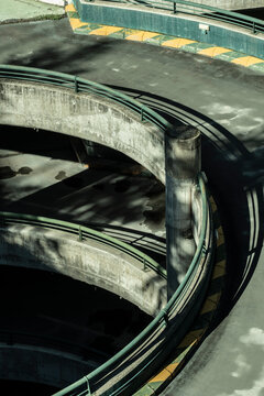 Abandoned parking lot reveals a hauntingly beautiful circular structure, a forgotten echo in an empty urban landscape