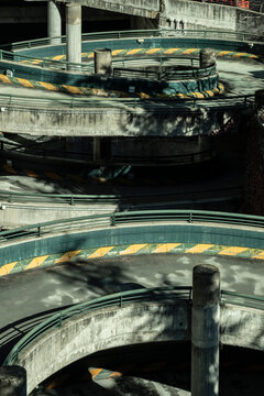 Abandoned parking lot reveals a hauntingly beautiful circular structure, a forgotten echo in an empty urban landscape