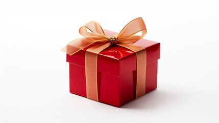 Beautiful red gift box with a gold ribbon bow. Concept of Christmas or Valentine's day
