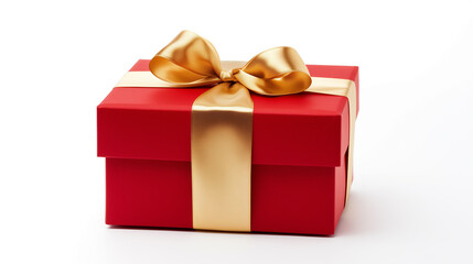 Beautiful red gift box with a gold ribbon bow. Concept of Christmas or Valentine's day