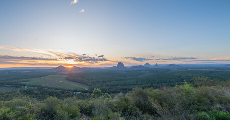 Tourists visit the Wildhorse scenic lookout for sunset panoramic views across the Glasshouse Mountains and the Sunshine Coast in Queensland