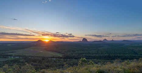 Tourists visit the Wildhorse scenic lookout for sunset panoramic views across the Glasshouse Mountains and the Sunshine Coast in Queensland