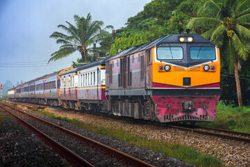 Fototapeta na wymiar Passenger train by diesel locomotive on the railway.