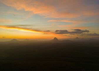 Tourists visit the Wildhorse scenic lookout for sunset panoramic views across the Glasshouse Mountains and the Sunshine Coast in Queensland