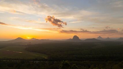 Tourists visit the Wildhorse scenic lookout for sunset panoramic views across the Glasshouse Mountains and the Sunshine Coast in Queensland