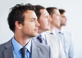 Men, thinking and serious for job interview, hiring selection and ready for finance career. Worker, corporate accountant in suit and professional in workplace, people in background and confident