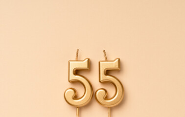 55 years celebration festive background made with golden candles in the form of number fifty-five....
