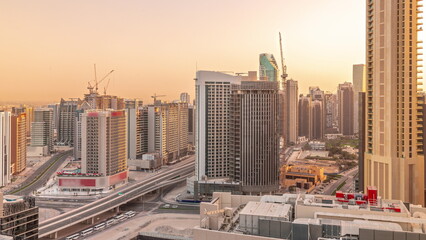 Skyscrapers at the Business Bay in Dubai aerial all day timelapse, United Arab Emirates