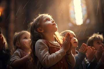 Foto op Plexiglas kids pray to god and jesus in the church © Kien