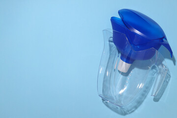 Water filter with a blue cap on a blue background